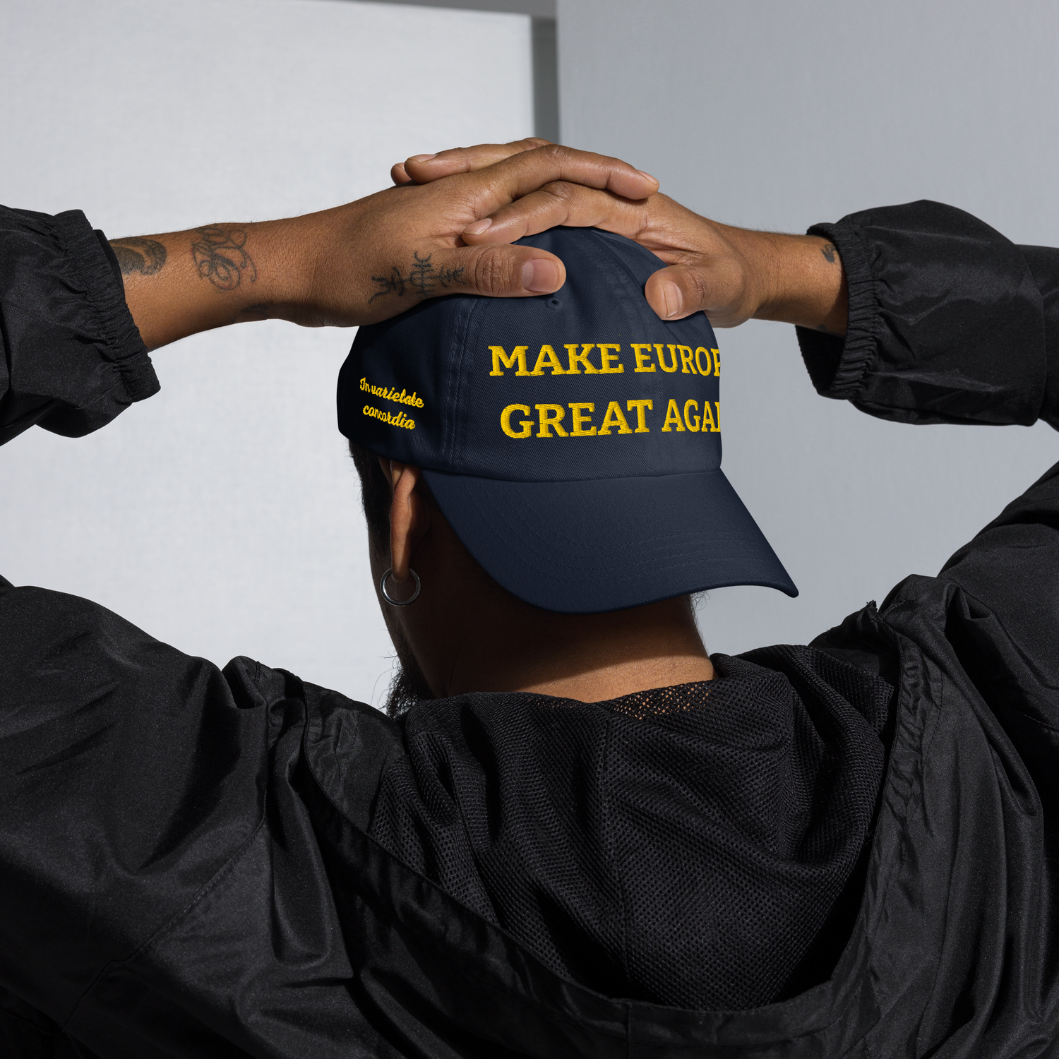 Person wearing MEGA / "Make Europe Great Again" cap backwards